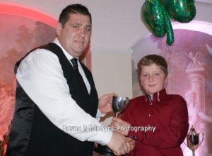 Enda Og McGarry receives the Under 12 North Antrim Cup