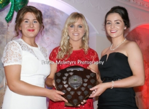 Aoife Kelly presents the Most Dedicated award to the Senior and Intermediate Camogie Team Captains Emma McMullan and Maria Lynn