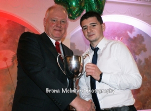 Seamus McCarry receives Clubman of the year for the 4th time from club Chairman Ciaran Doherty