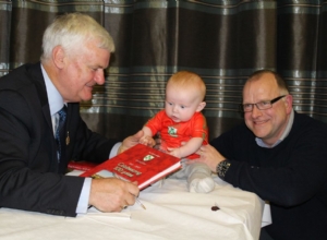 PRESIDENT WITH TOMMY MCINTYRE AND HIS GRANDSON